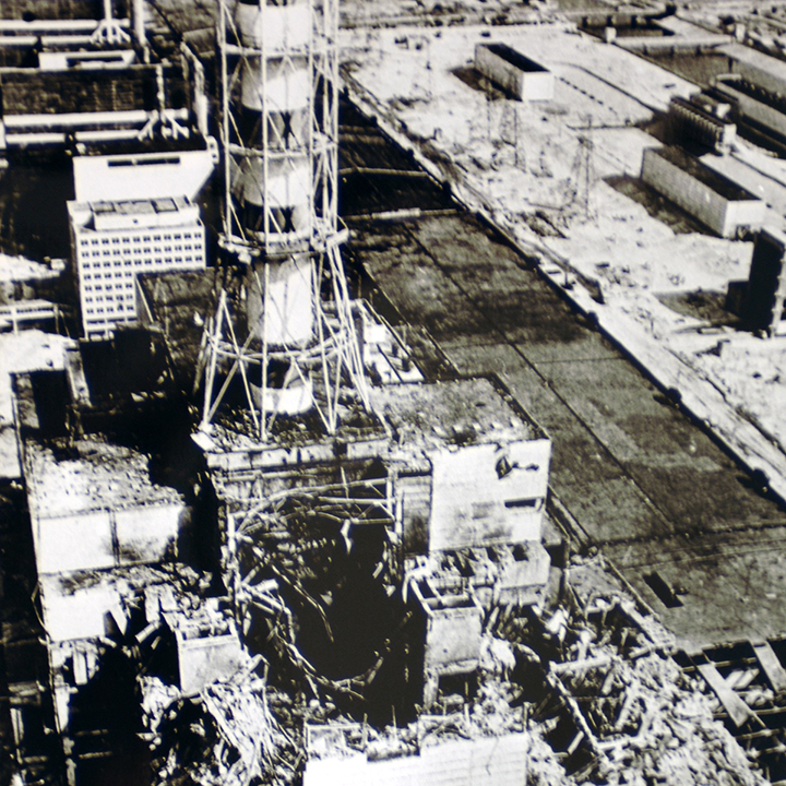 Aerial view of
the Chernobyl nuclear power plant after the accident. The entire structure
is damaged and the roof is gone. There is debris surrounding the building.