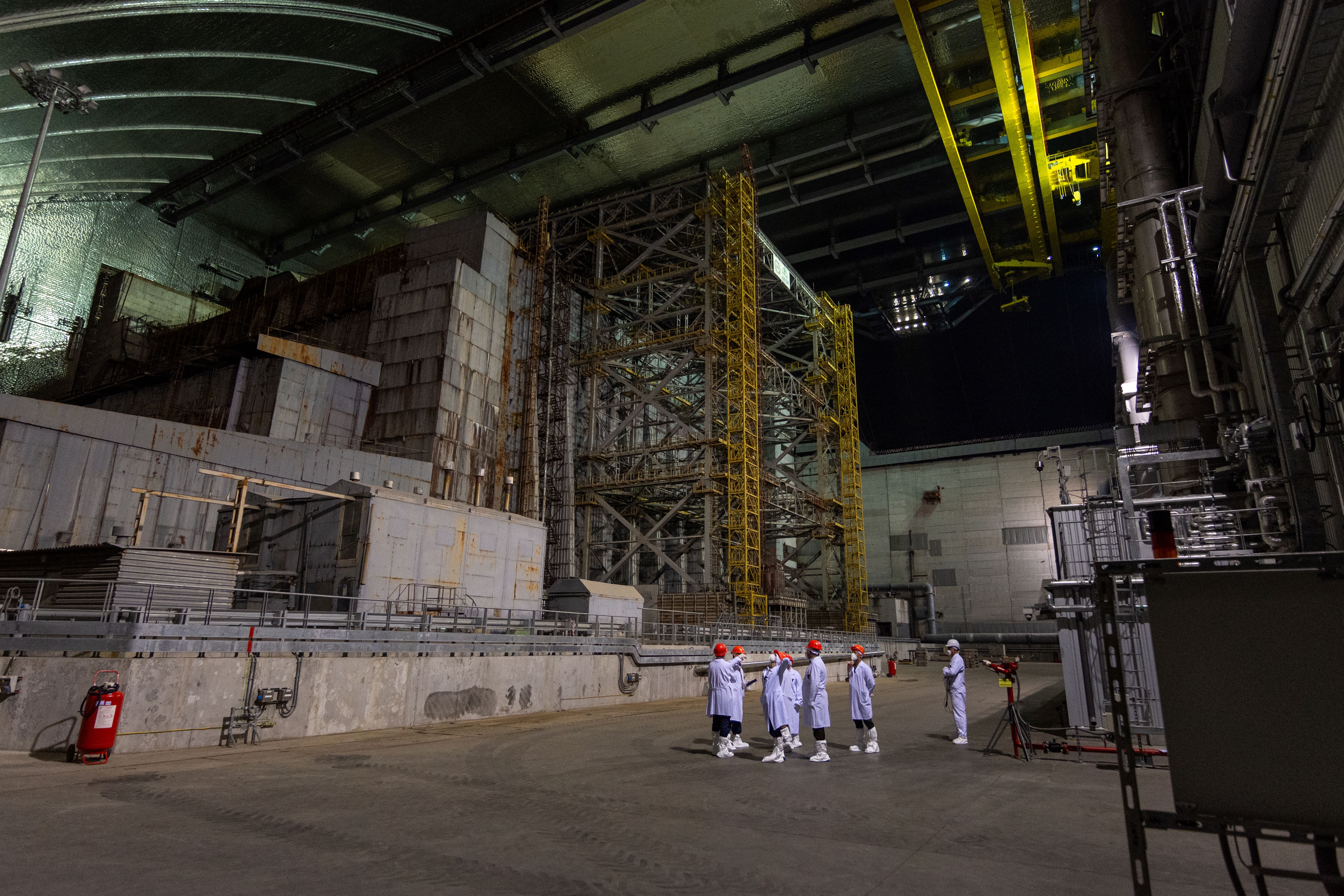 CNSC President Rumina Velshi in front of reactor #4 at the Chornobyl Nuclear Power Plant