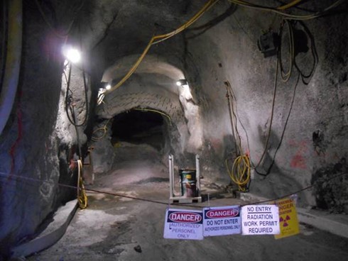 A photograph showing warning signage utilized in an underground work area at a uranium mine.