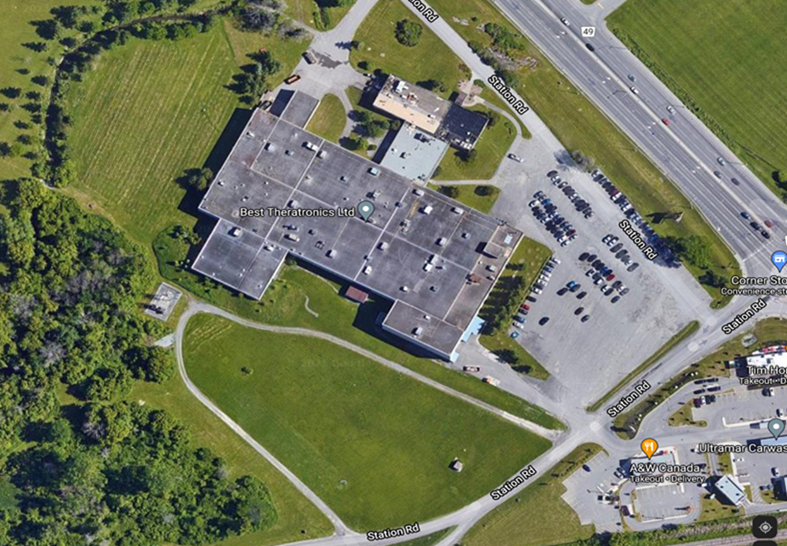 The facility is shown from above in an aerial photo. It is surrounded by fields and green space.