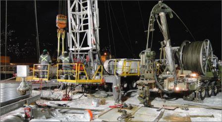 Figure 3-12: Surface rig and coil tubing rig outfitting surface freeze holes, Cigar Lake Operation