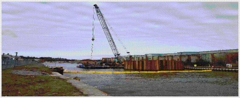 This picture shows a ground-level view of the work being done at the Port Hope Harbour as part of the Port Hope Project.