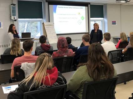 Image of students learning about radiation fundamentals from CNSC staff