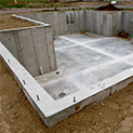 The concrete foundation of a basement.