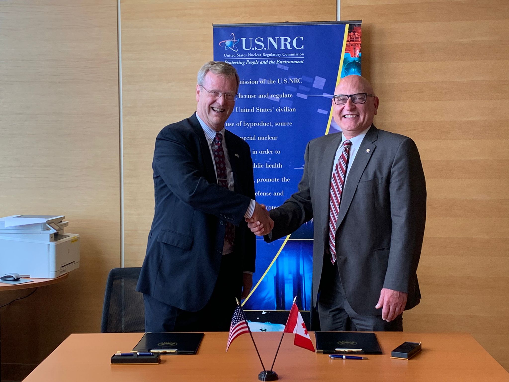 Daniel H. Dorman, U.S. NRC Executive Director for Operations (Left), and Ramzi Jammal, CNSC Executive Vice-President and Chief Regulatory Operations Officer (Right), at the signing of the charter.