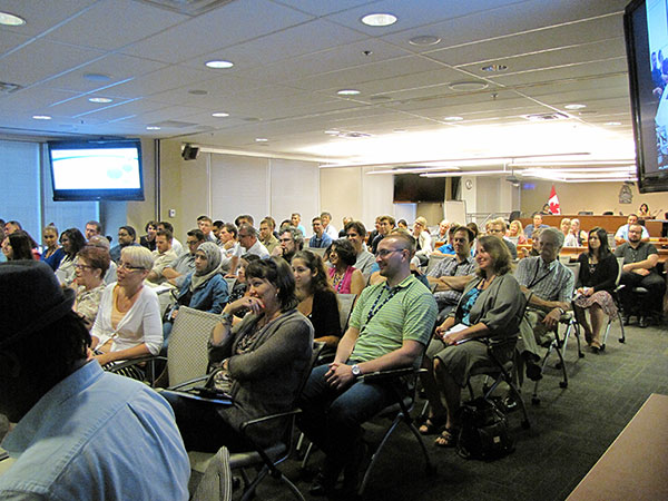 Staff members watching a presentation