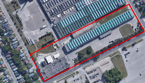 An aerial photo shows the facility delineated in a red rectangle. The facility includes one building. 